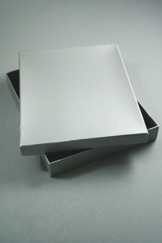 Silver Matt Finish Giftbox. This Box Has a Black Flocked Foam Pad Insert with Two Top Slits and Two Side Slits and Holes for Earring Wires. Approx Size 18cm x 14cm x 2.6cm.