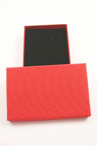 Red Gift Box with Black Flock Inner with top slits and holes for earrings. Approx Size 11cm x 7cm x 2.2cm