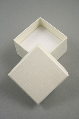 Lined Textured Cream Gift Box with White Flock Insert with an H shaped slit to fit a ring shank Size 5cm x 5cm x 3.5cm.