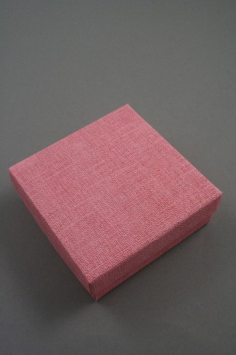 Pink Linen Effect Gift Box with Black Flocked Inner. Approx Size: 9cm x 9cm x 3cm.