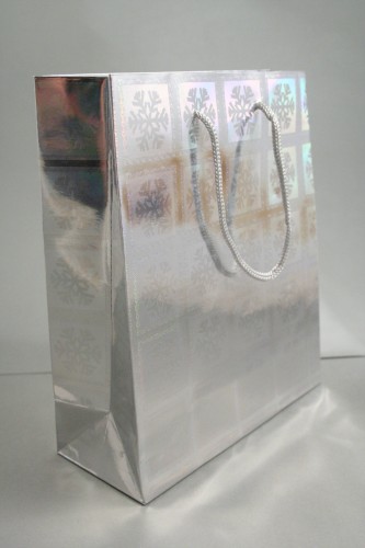 Silver Snowflake Christmas Print Holographic Gift Bag with Grey Cord Handles. Approx Size 21.5cm x 18cm x 7.5cm