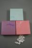 Coloured Paper Giftbox with Ribbon Bow and White Pad Insert. In 3 Colours. Pink, Lilac and Turquoise. 4 of each. Approx 8.5cm x 8.5cm x 3cm.  - view 1