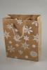 Natural Brown Kraft Paper Gift Bag with Silver Foil Snowflake Print and Brown Corded Handles. Size Approx 15cm x 12cm x 6cm. - view 1