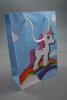 Blue Gift Bag with Unicorn and Rainbow Print with White Corded Handles. Approx Size 20cm x 14cm x 7cm - view 1